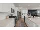 Spacious kitchen showcasing stainless appliances, tile backsplash, and convenient breakfast bar seating at 238 Bird Song Path, Summerville, SC 29485