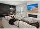 Cozy open concept living area features a fireplace and dining area with large sectional couch at 238 Bird Song Path, Summerville, SC 29485