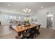 Open-concept living area with lots of windows, kitchen, dining area and spacious sectional couch at 238 Bird Song Path, Summerville, SC 29485