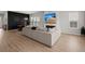 Open-concept living area with a view of a modern fireplace, large sofa, and dining area at 238 Bird Song Path, Summerville, SC 29485