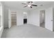 Spacious bedroom with an open closet, an ensuite bathroom, and gray carpeting at 242 Swallowtail Ln, Goose Creek, SC 29445