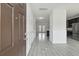 Inviting foyer with stylish gray wood floors, modern wainscoting, and views into the open floorplan at 242 Swallowtail Ln, Goose Creek, SC 29445