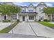 Charming townhome featuring a metal roof, well-maintained landscaping, and a spacious concrete driveway at 242 Swallowtail Ln, Goose Creek, SC 29445