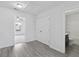 Hallway with views to a carpeted bedroom with a window and a bathroom with a black vanity at 242 Swallowtail Ln, Goose Creek, SC 29445
