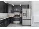 Contemporary kitchen featuring stainless steel appliances, granite counters, and dark cabinets at 242 Swallowtail Ln, Goose Creek, SC 29445