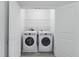 Laundry room with side-by-side washer and dryer units and wire shelving at 242 Swallowtail Ln, Goose Creek, SC 29445
