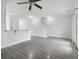 Open-concept living room with hardwood floors, and bar-style dining area at 242 Swallowtail Ln, Goose Creek, SC 29445