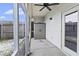 Covered screened porch with ceiling fan and storage shed at 242 Swallowtail Ln, Goose Creek, SC 29445