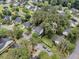 Bird's eye view of homes in a lushly landscaped neighborhood with mature trees and community pond at 2467 Bergeron Way, Mount Pleasant, SC 29466