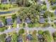 Aerial view showcases a neighborhood with mature trees, well-manicured lawns, and a peaceful ambiance at 2467 Bergeron Way, Mount Pleasant, SC 29466