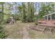 Large backyard with playground, raised garden beds, and a deck at 2467 Bergeron Way, Mount Pleasant, SC 29466