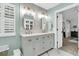 Stylish bathroom features double sinks, oval mirrors, and modern fixtures at 2467 Bergeron Way, Mount Pleasant, SC 29466
