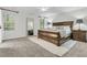 Spacious bedroom with a large bed, a full length mirror, and natural light at 2467 Bergeron Way, Mount Pleasant, SC 29466