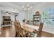 Traditional dining room features hardwood floors, an elegant chandelier, and white plantation shutters at 2467 Bergeron Way, Mount Pleasant, SC 29466