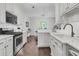 Modern kitchen equipped with stainless steel appliances and bright countertops at 2467 Bergeron Way, Mount Pleasant, SC 29466