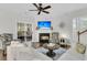 Comfortable living room with fireplace and sliding glass doors to the screened patio at 2467 Bergeron Way, Mount Pleasant, SC 29466