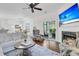 Cozy living room with fireplace, hardwood floors, and access to screened porch at 2467 Bergeron Way, Mount Pleasant, SC 29466