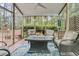Relaxing screened porch with comfortable seating and an outdoor ceiling fan at 2467 Bergeron Way, Mount Pleasant, SC 29466