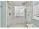 Modern marble shower with glass enclosure, rain shower head, and built-in bench at 2467 Bergeron Way, Mount Pleasant, SC 29466