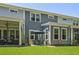 Exterior view of property featuring a shaded patio, green backyard, and privacy fence at 2648 Balena Dr, Mount Pleasant, SC 29466