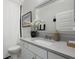 Well-lit bathroom features a sink, modern fixtures, large mirror, and nearby toilet at 2648 Balena Dr, Mount Pleasant, SC 29466