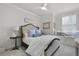Cozy bedroom features a ceiling fan, a bed with blue pillows, and a window seat at 2648 Balena Dr, Mount Pleasant, SC 29466