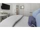 Bedroom close up featuring white bedding, end table, and accent pillows at 2648 Balena Dr, Mount Pleasant, SC 29466