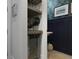 A stylish bar featuring wine storage, beverage cooler, and a view of the uniquely decorated powder room at 2648 Balena Dr, Mount Pleasant, SC 29466