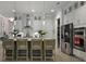 Stylish kitchen island with pendant lights and bar stool seating complemented by stainless steel appliances at 2648 Balena Dr, Mount Pleasant, SC 29466