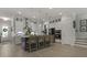 Contemporary kitchen island with modern pendant lighting, bar stools, and stainless steel appliances at 2648 Balena Dr, Mount Pleasant, SC 29466
