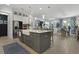Open-concept kitchen featuring a large kitchen island, pendant lighting, and stainless steel appliances at 2648 Balena Dr, Mount Pleasant, SC 29466