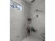 Modern shower with marble-style tile, a window, and sleek fixtures at 2648 Balena Dr, Mount Pleasant, SC 29466