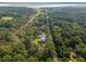 Aerial shot showing a tranquil neighborhood surrounded by lush greenery and river views at 2790 Burden Creek Rd, Johns Island, SC 29455