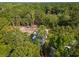 An aerial perspective of the home nestled among lush greenery and mature trees at 2790 Burden Creek Rd, Johns Island, SC 29455