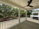 Large back porch with a ceiling fan showcasing picturesque yard views at 2790 Burden Creek Rd, Johns Island, SC 29455