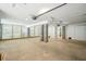 Unfinished basement features concrete pillars, garage door openers and an open layout at 2790 Burden Creek Rd, Johns Island, SC 29455