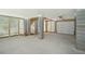 The expansive basement features garage access, sturdy support columns, and natural light at 2790 Burden Creek Rd, Johns Island, SC 29455