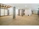 Unfinished basement with concrete pillars, wood rafters and multiple entry doors at 2790 Burden Creek Rd, Johns Island, SC 29455