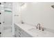 Bright bathroom featuring double sink vanity, white countertops and stylish shower with white tiles at 2790 Burden Creek Rd, Johns Island, SC 29455
