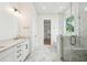 Modern bathroom featuring marble floors and a glass-enclosed shower, and access to walk-in closet at 2790 Burden Creek Rd, Johns Island, SC 29455