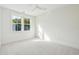 Bedroom featuring neutral carpet, bright natural light from window, and a ceiling fan at 2790 Burden Creek Rd, Johns Island, SC 29455
