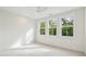Bright bedroom with large windows offering scenic views and abundant natural light at 2790 Burden Creek Rd, Johns Island, SC 29455