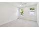 Bright and airy bedroom featuring neutral carpet, two windows with natural light and a ceiling fan at 2790 Burden Creek Rd, Johns Island, SC 29455