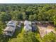 Stunning aerial view of the home with a tree lined perimeter giving the space a secluded feel at 2790 Burden Creek Rd, Johns Island, SC 29455