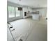 Spacious kitchen with white cabinets, countertops, and modern lighting fixtures at 2790 Burden Creek Rd, Johns Island, SC 29455