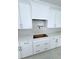 Kitchen features white cabinets, subway tile backsplash, and gold hardware at 2790 Burden Creek Rd, Johns Island, SC 29455