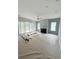 Living room with fireplace and large windows at 2790 Burden Creek Rd, Johns Island, SC 29455