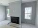 Living room features a fireplace and windows at 2790 Burden Creek Rd, Johns Island, SC 29455