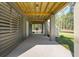 A covered patio offering an outdoor area with natural light and views of the backyard at 2790 Burden Creek Rd, Johns Island, SC 29455