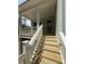 Front porch stairs leading up to a light blue house with white railings at 2790 Burden Creek Rd, Johns Island, SC 29455